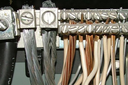 Close-up of wires and cables, showcasing intricate network connections.